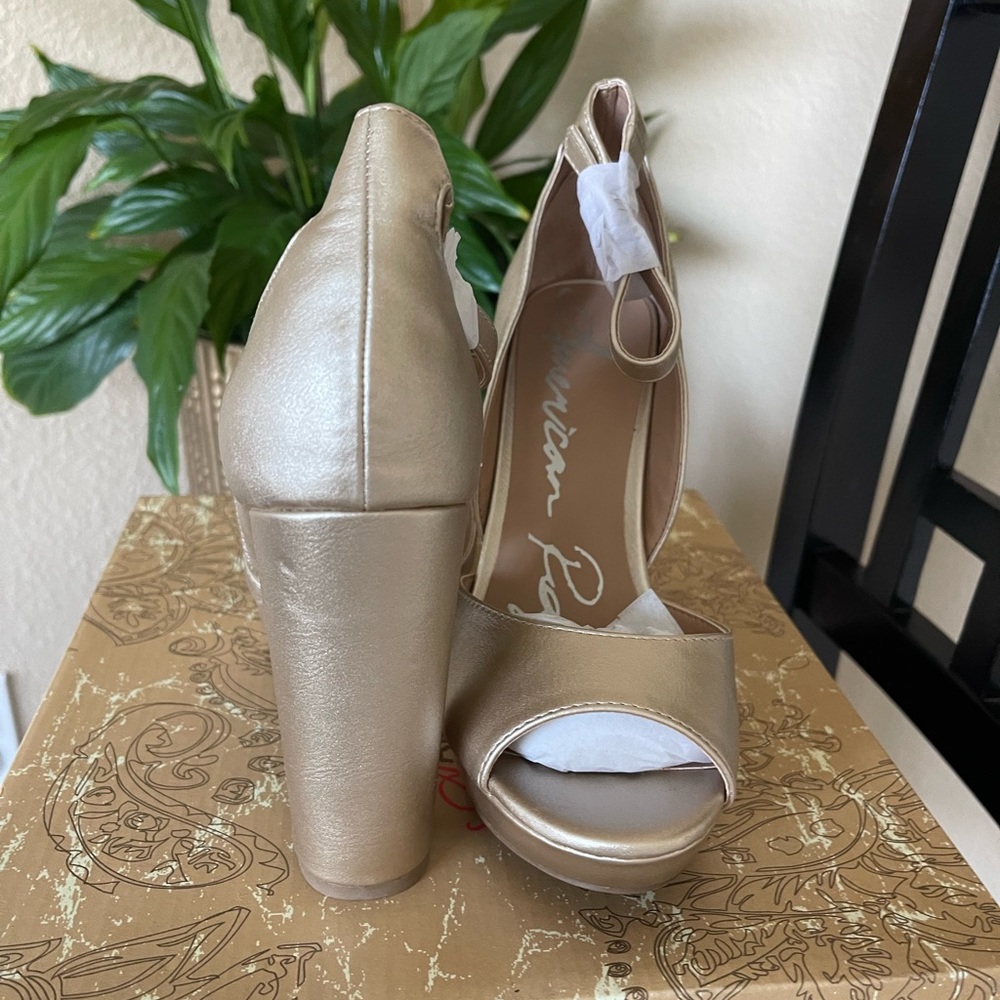 Gold open toe high heels.